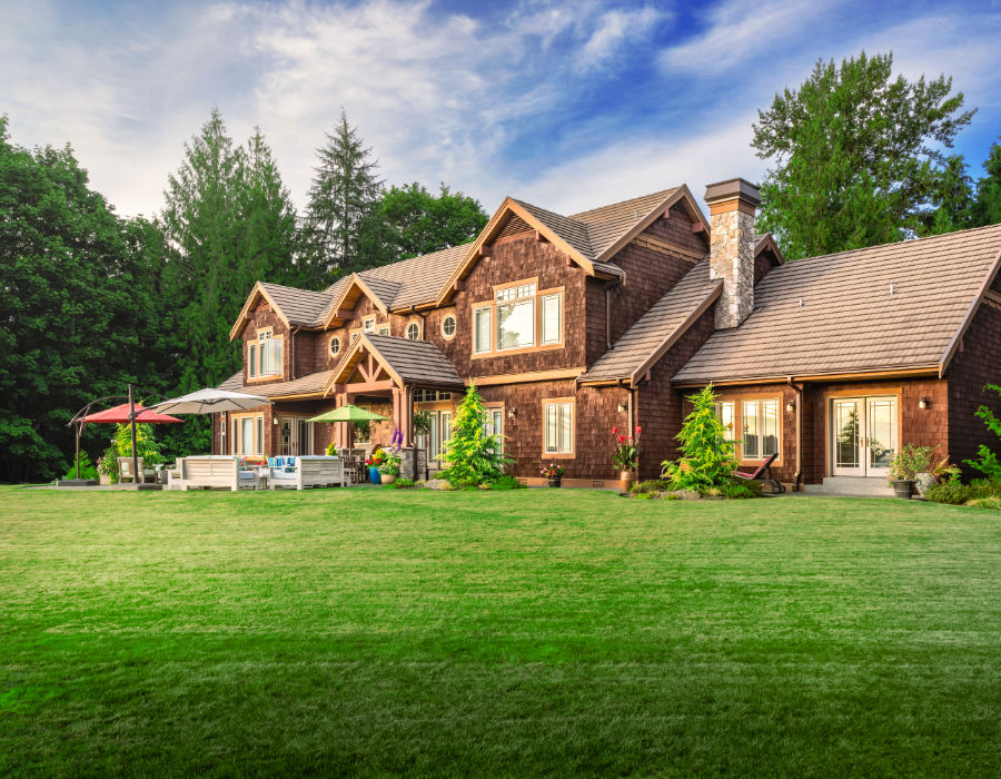 man mows fallen leaves