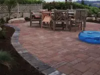 Flowing paver patio with accent border.