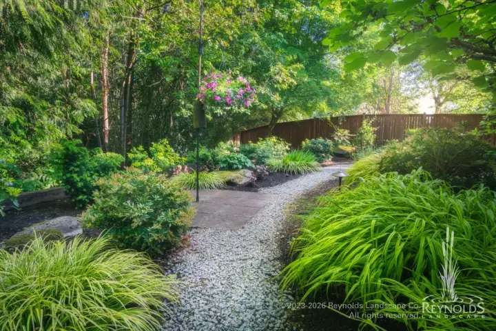 gravel path through lush plantings